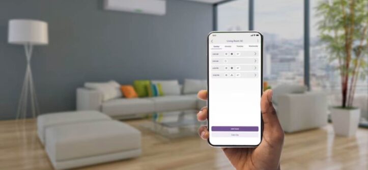 A smartphone screen showing a smart home app controlling lights and thermostat in a cozy living room.